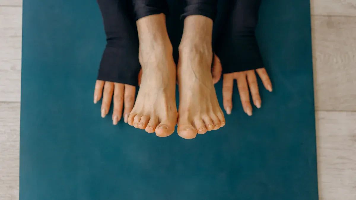 Can I wear socks during yoga practice or should I go barefoot? -